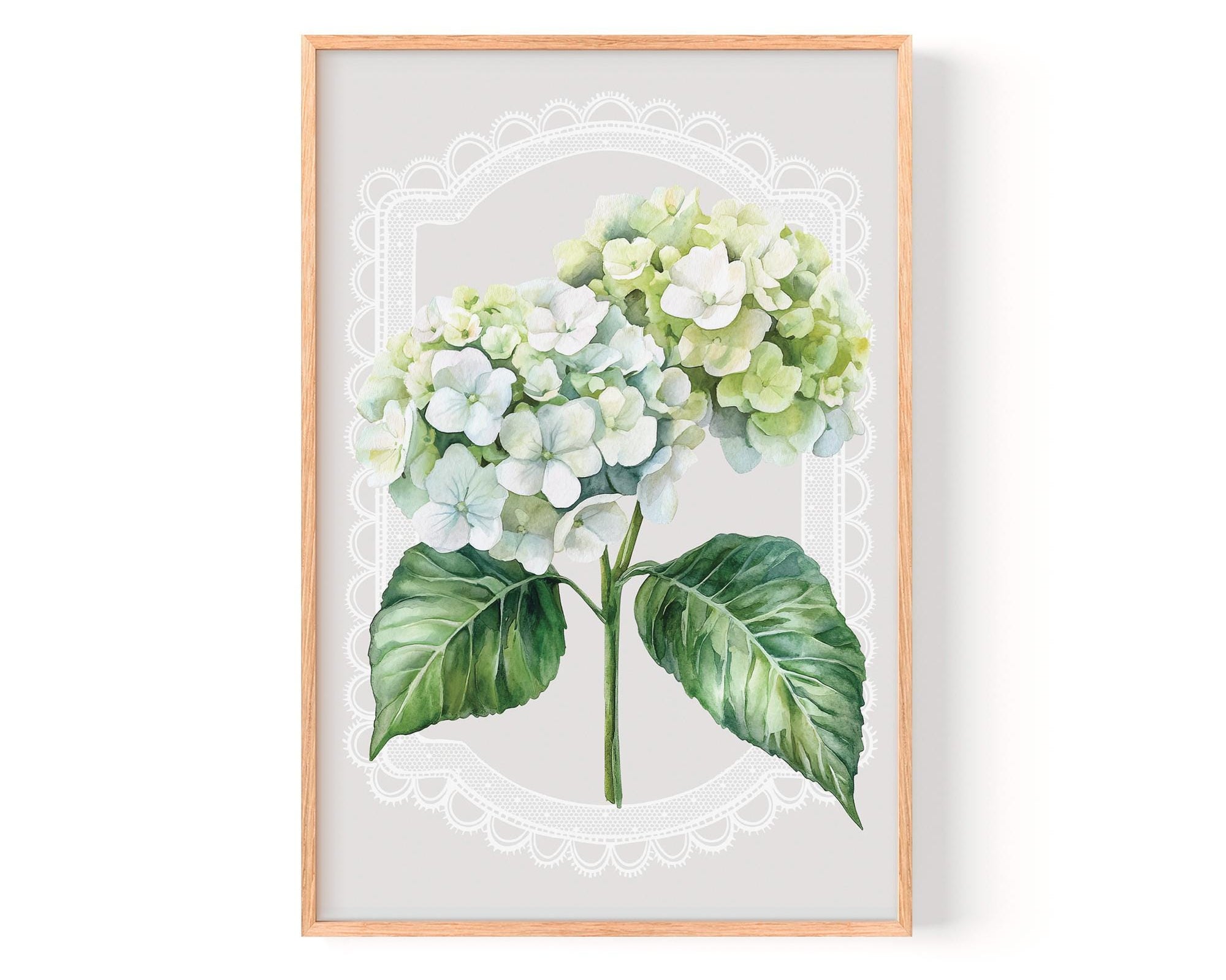 A framed print of a watercolor painting depicting a bouquet of white hydrangea flowers with green leaves.