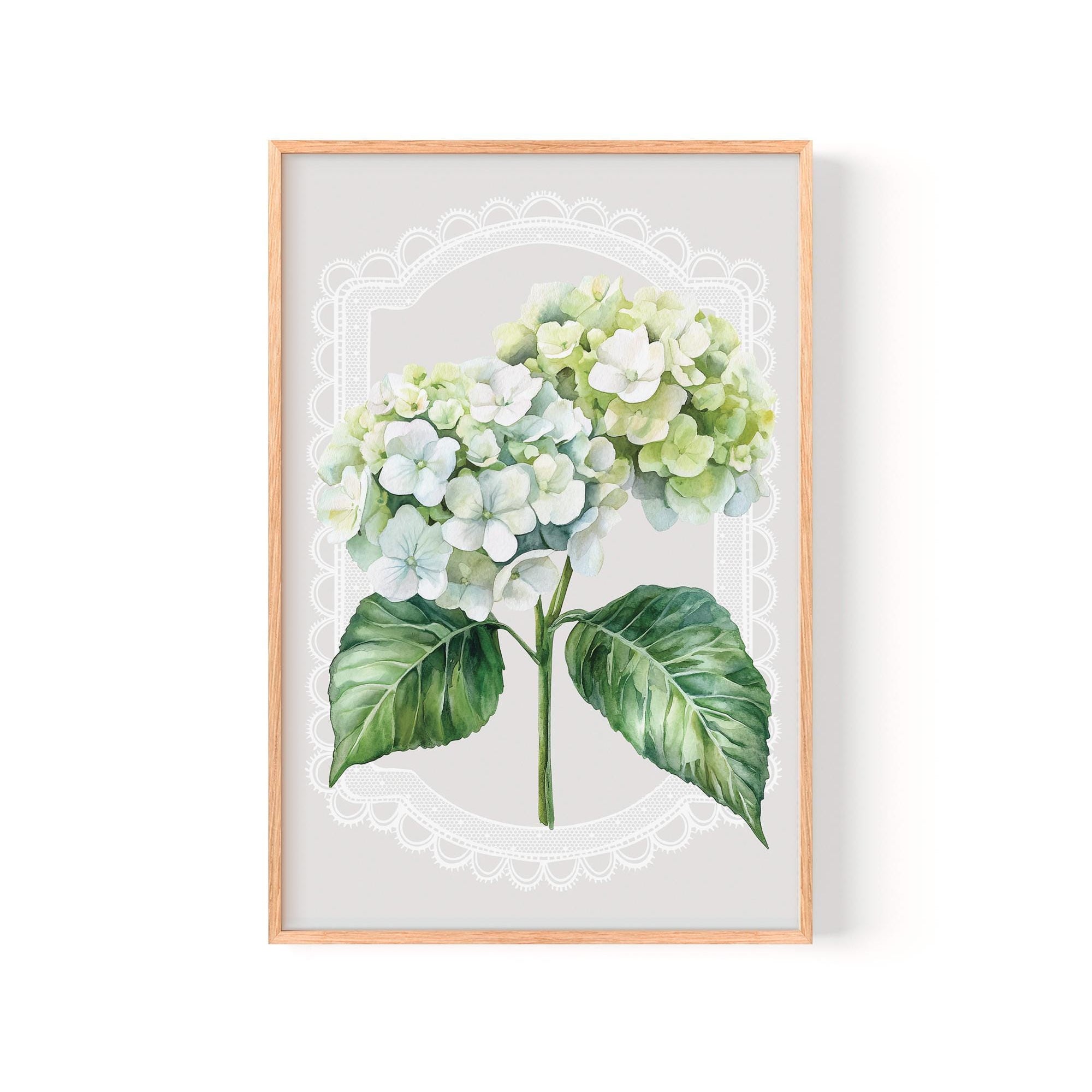 A framed print of a watercolor painting depicting a bouquet of white hydrangea flowers with green leaves.