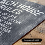 The image is a close-up of a textured surface with the words "Each house rules" printed on it.