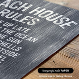 The image is a close-up of a textured surface with the words "Each house rules" printed on it.