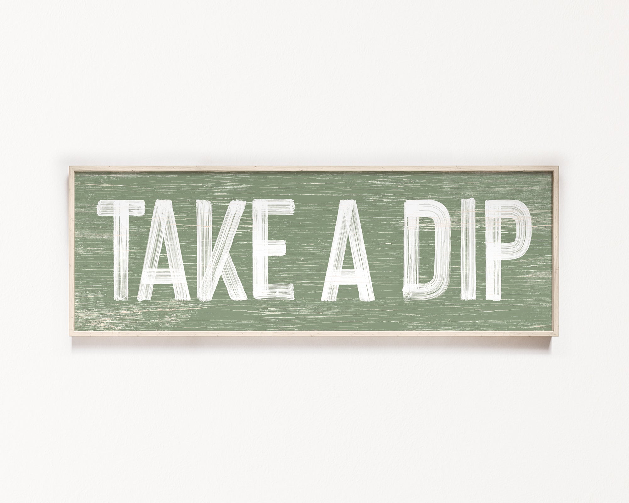 a wooden sign that says take a dip