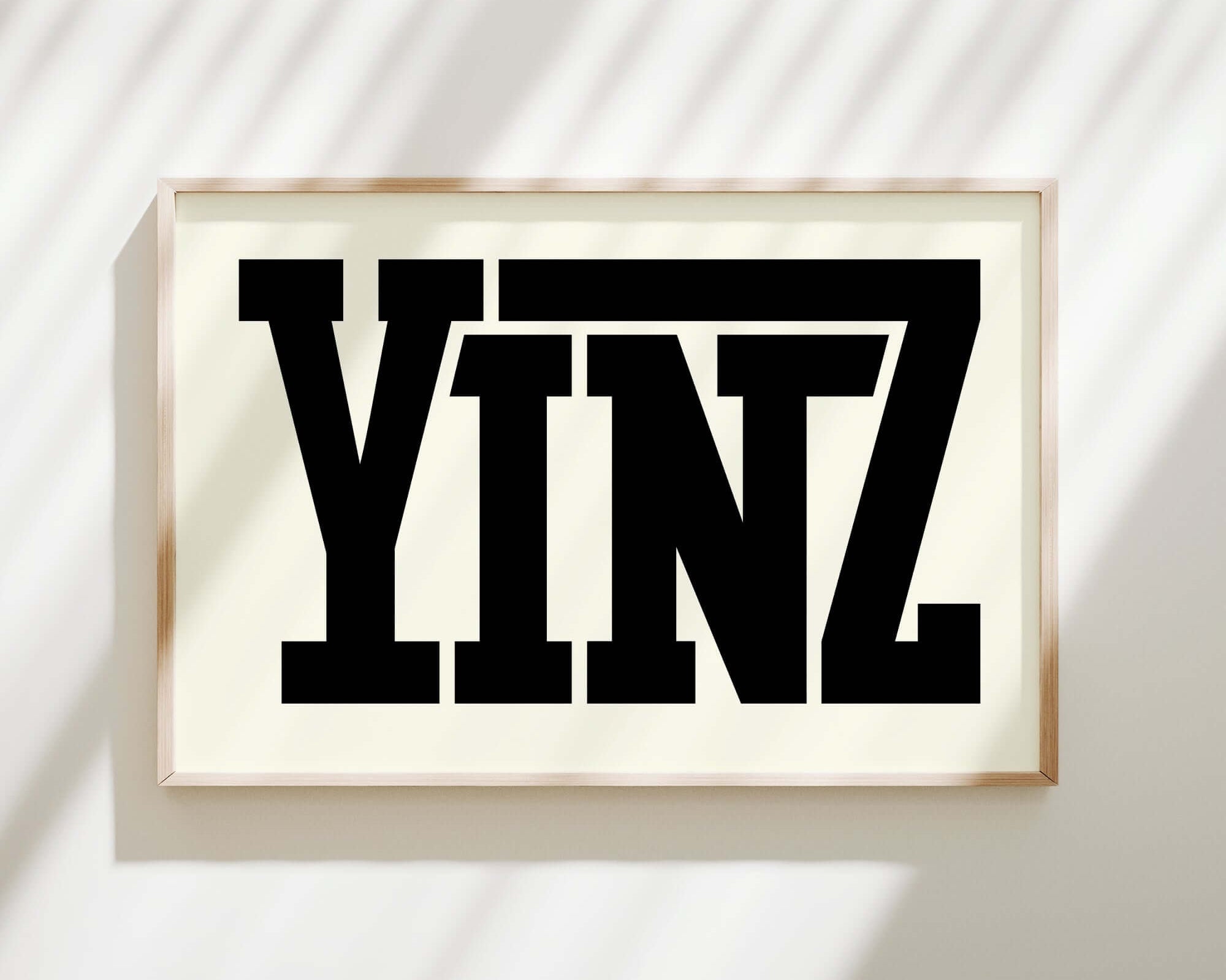 The Yinz Sign Print, Off White, features “YINZ” in bold black letters on an off white background—perfect for bringing Pittsburgh charm to your home decor.