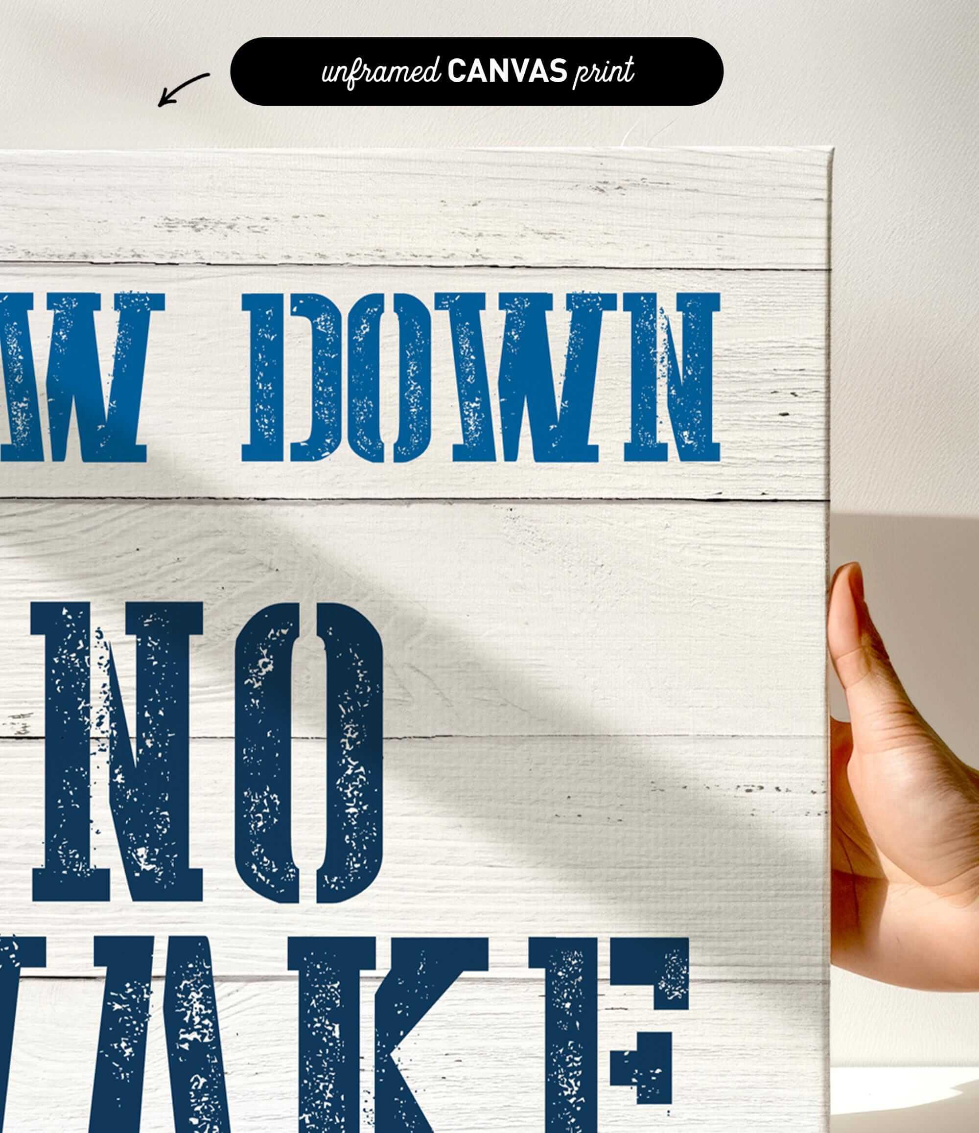 a hand holding a sign that says draw down no wake