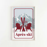 A framed print depicting two red Adirondack chairs with skis in the background, set against a snowy mountain landscape.