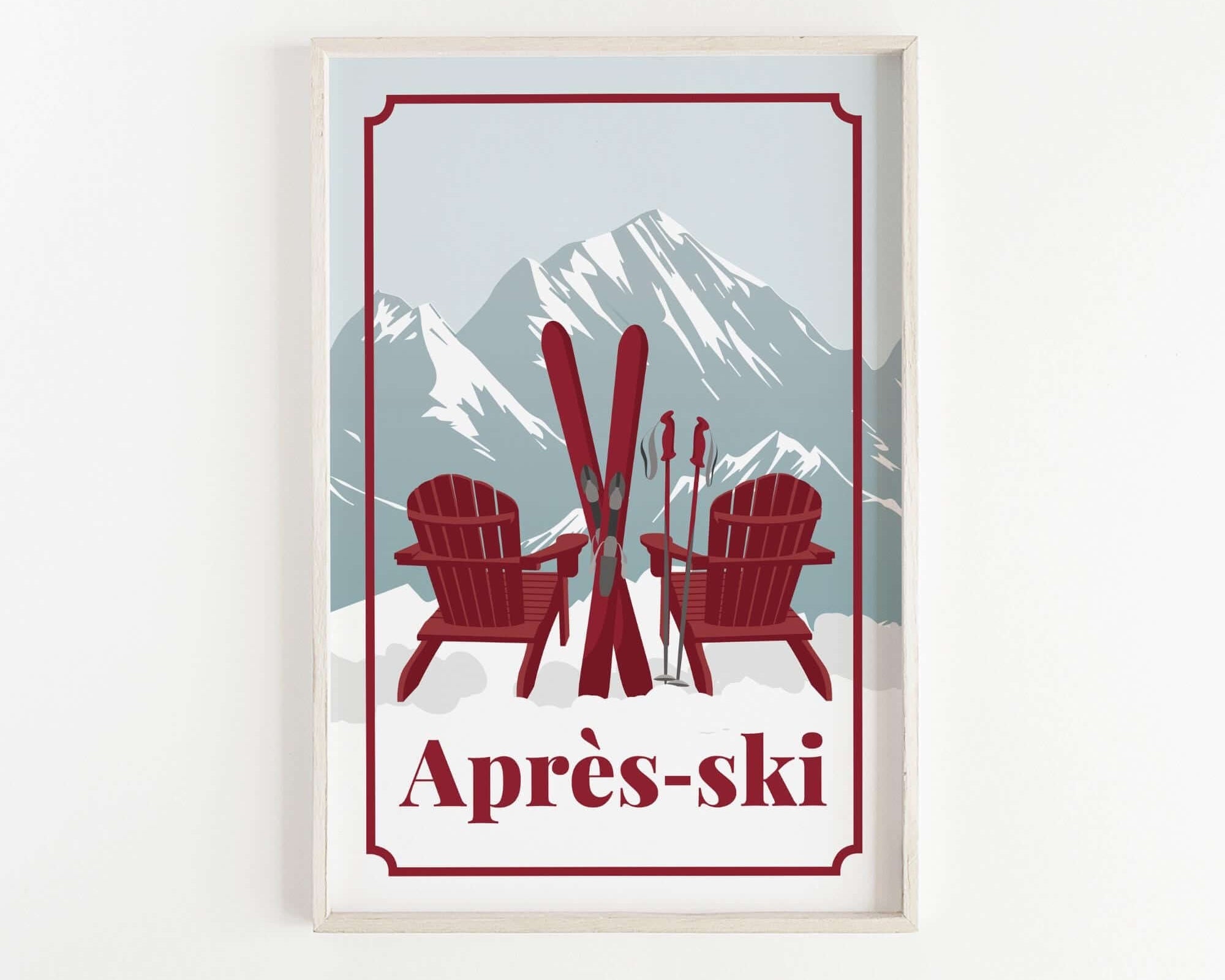 A framed print depicting two red Adirondack chairs with skis in the background, set against a snowy mountain landscape.