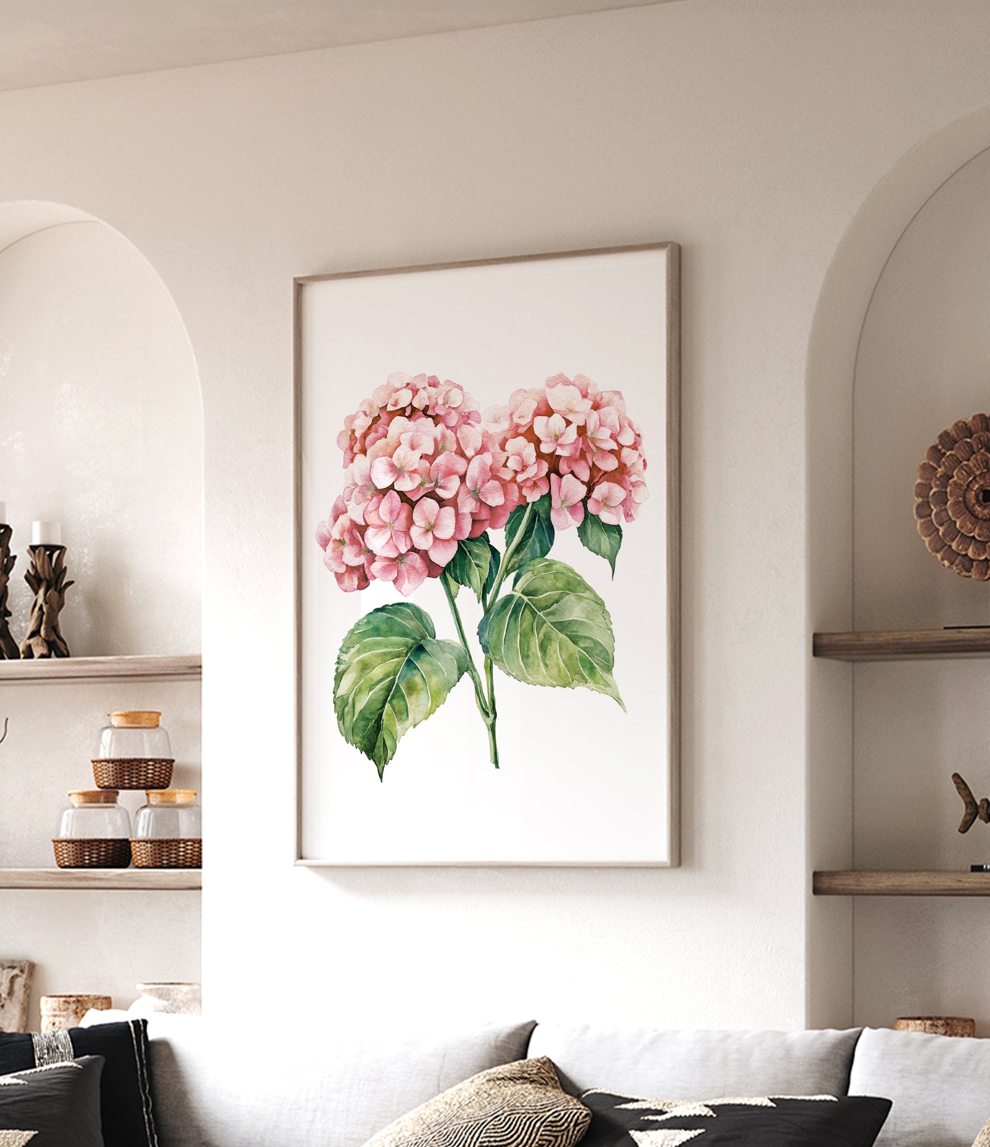 a framed painting of pink hydrangeas hanging on a wall in a living room.