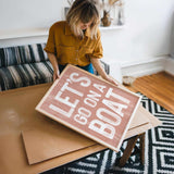 a woman holding a sign that reads let go and let go