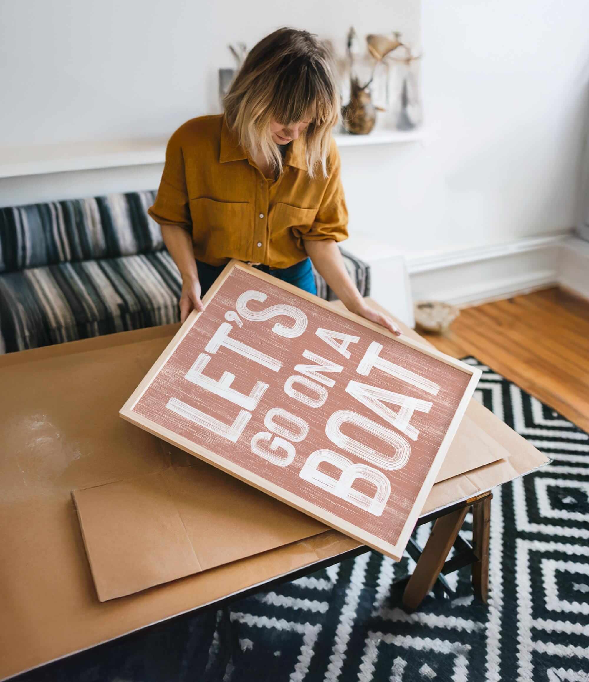 a woman holding a sign that reads let go and let go
