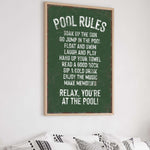 a poster hanging on the wall above a bed