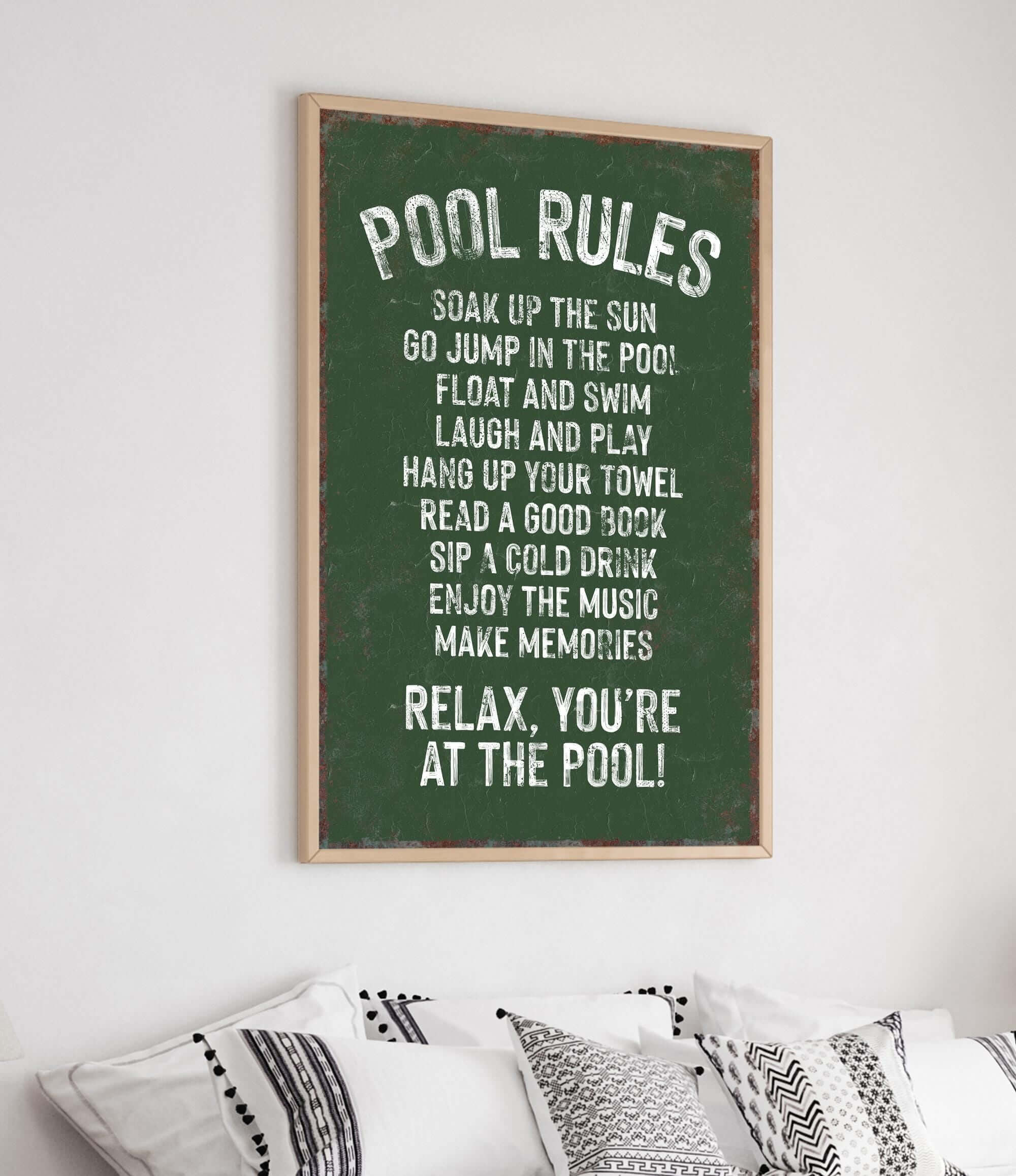 a poster hanging on the wall above a bed