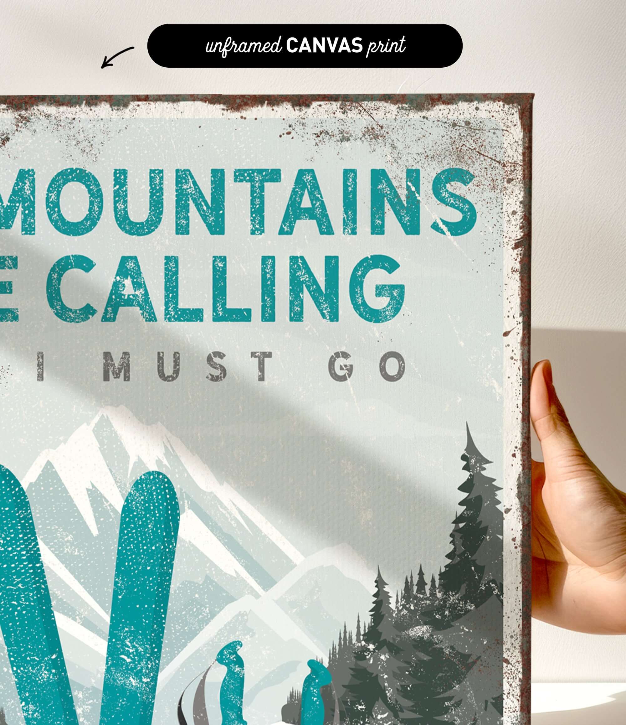 a hand holding a sign that says mountains are calling