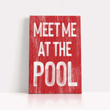 a red sign that says meet me at the pool