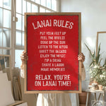 a woman holding a sign that says lanai rules