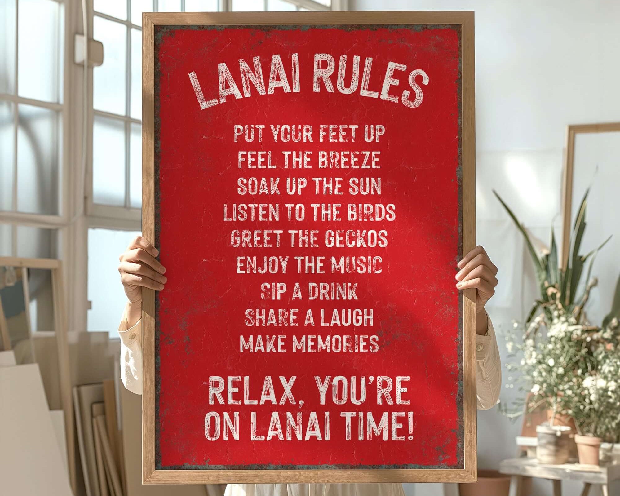 a woman holding a sign that says lanai rules