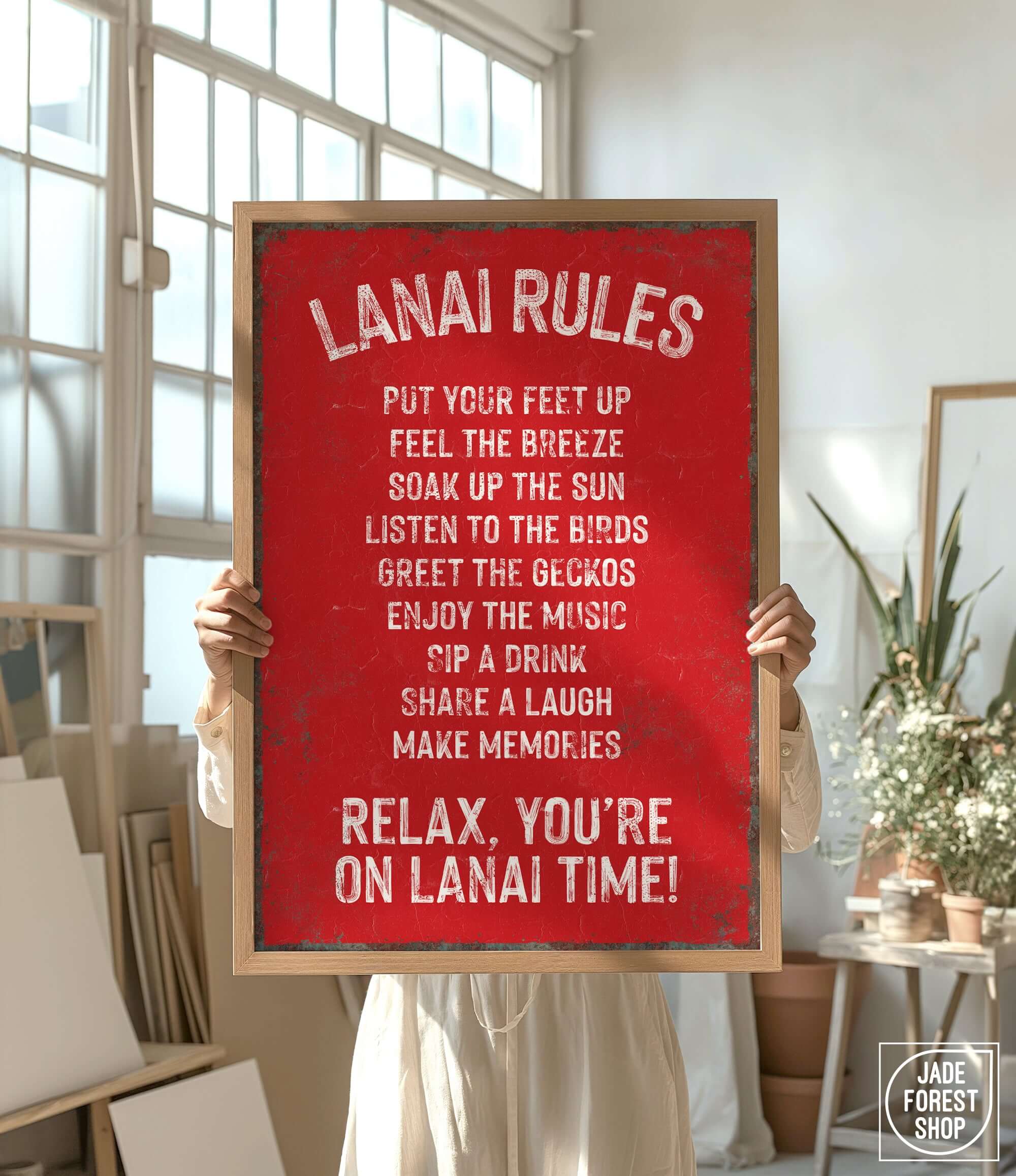 a woman holding a sign that says lanai rules