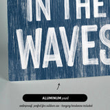 there is a sign that says in the waves