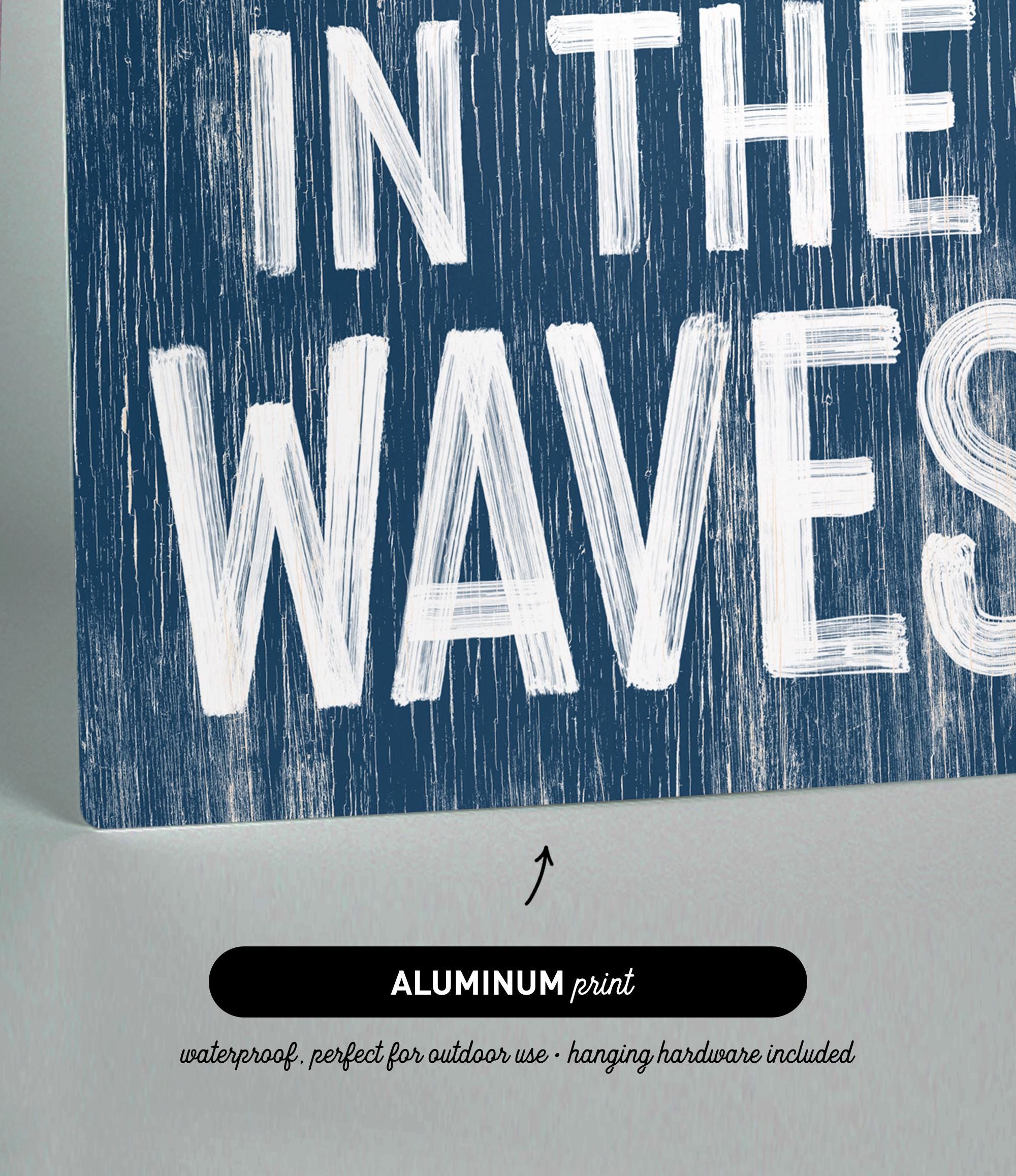 there is a sign that says in the waves