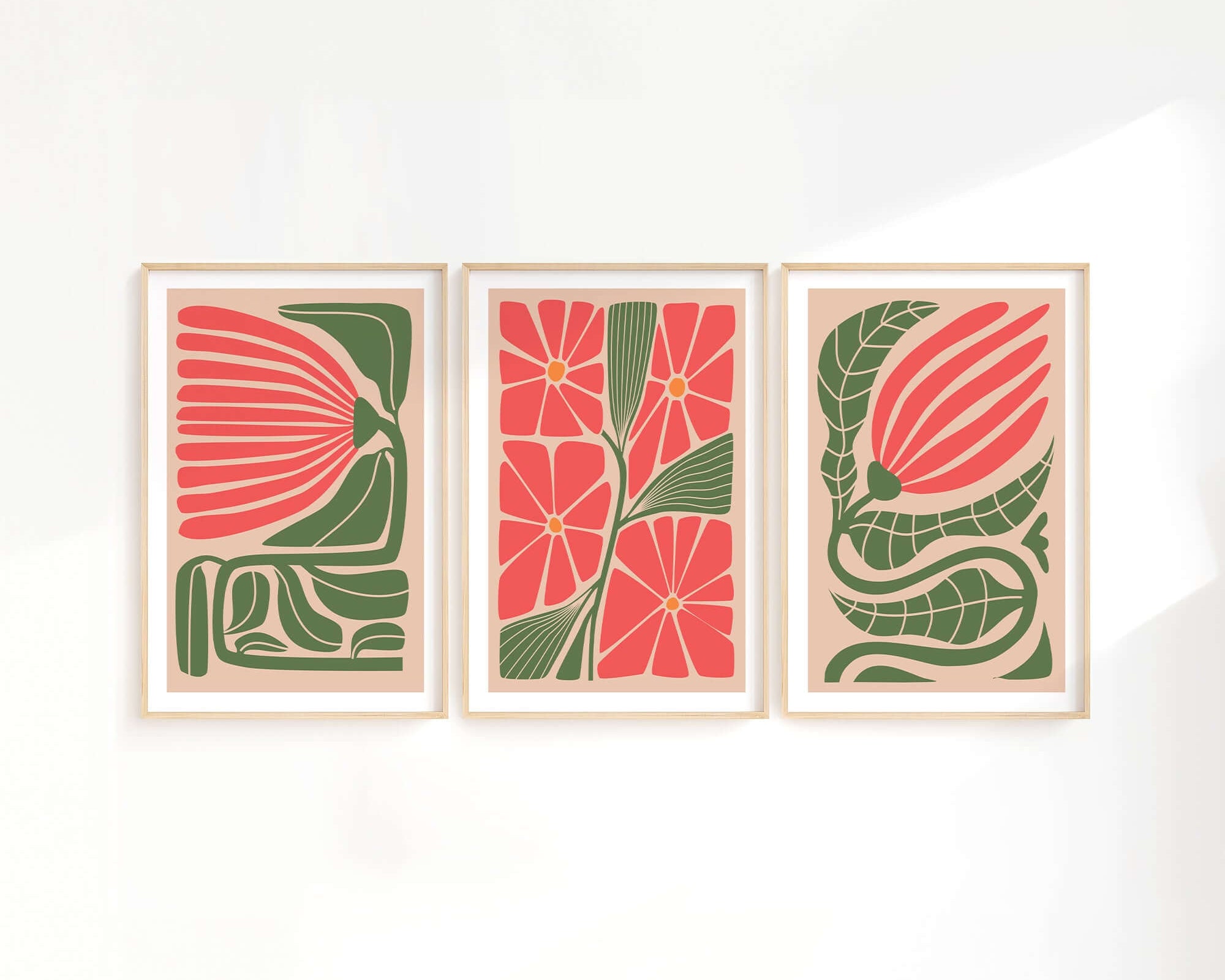 The Flower Blocks Triptych | Set of Three Prints | 015 features abstract floral art in green and coral, bringing a modern vibe to your decor when displayed as wall art on a crisp white wall.