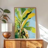 a large, vibrant painting of a banana tree hanging on a wall above a wooden cabinet.