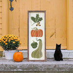 a black cat sitting in front of a door