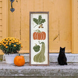 a black cat sitting in front of a door