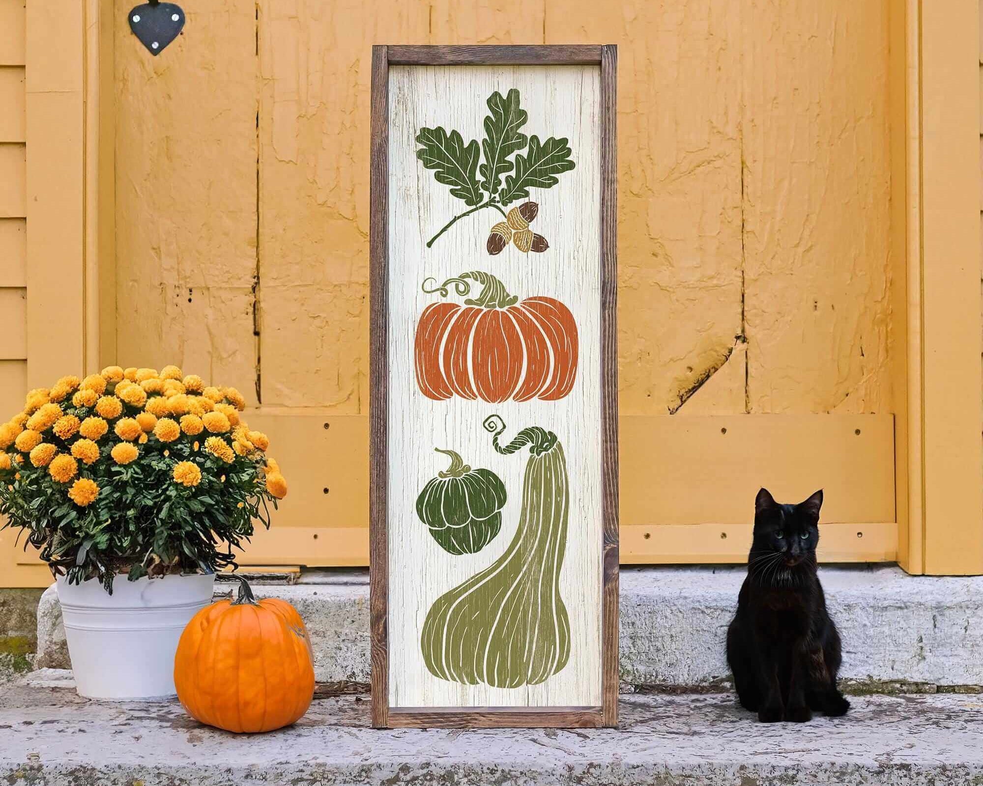 a black cat sitting in front of a door