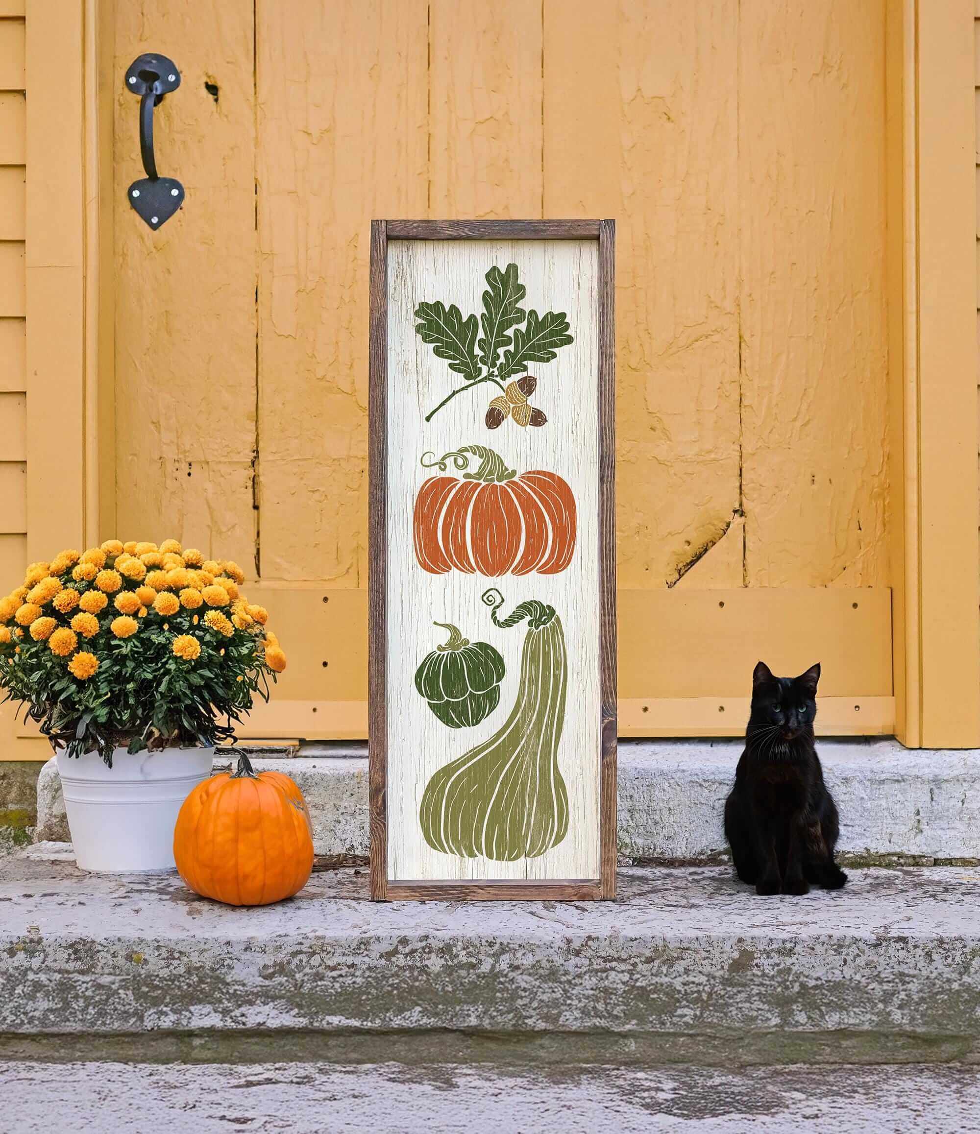 a black cat sitting in front of a door