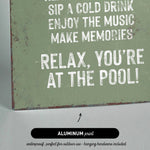 a sign that reads relax you&#39;re at the pool