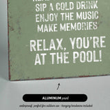 a sign that reads relax you&#39;re at the pool