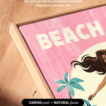 a vibrant, colorful artwork with the word "BEACH" prominently displayed in the center. The artwork is framed in a natural frame, and the text indicates that it is a canvas print.