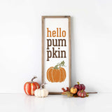 a sign that says hello pumpkin pumpkin next to some pumpkins