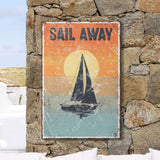 a sail away sign on a stone wall
