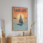 a picture of a sailboat on a wall above a dresser