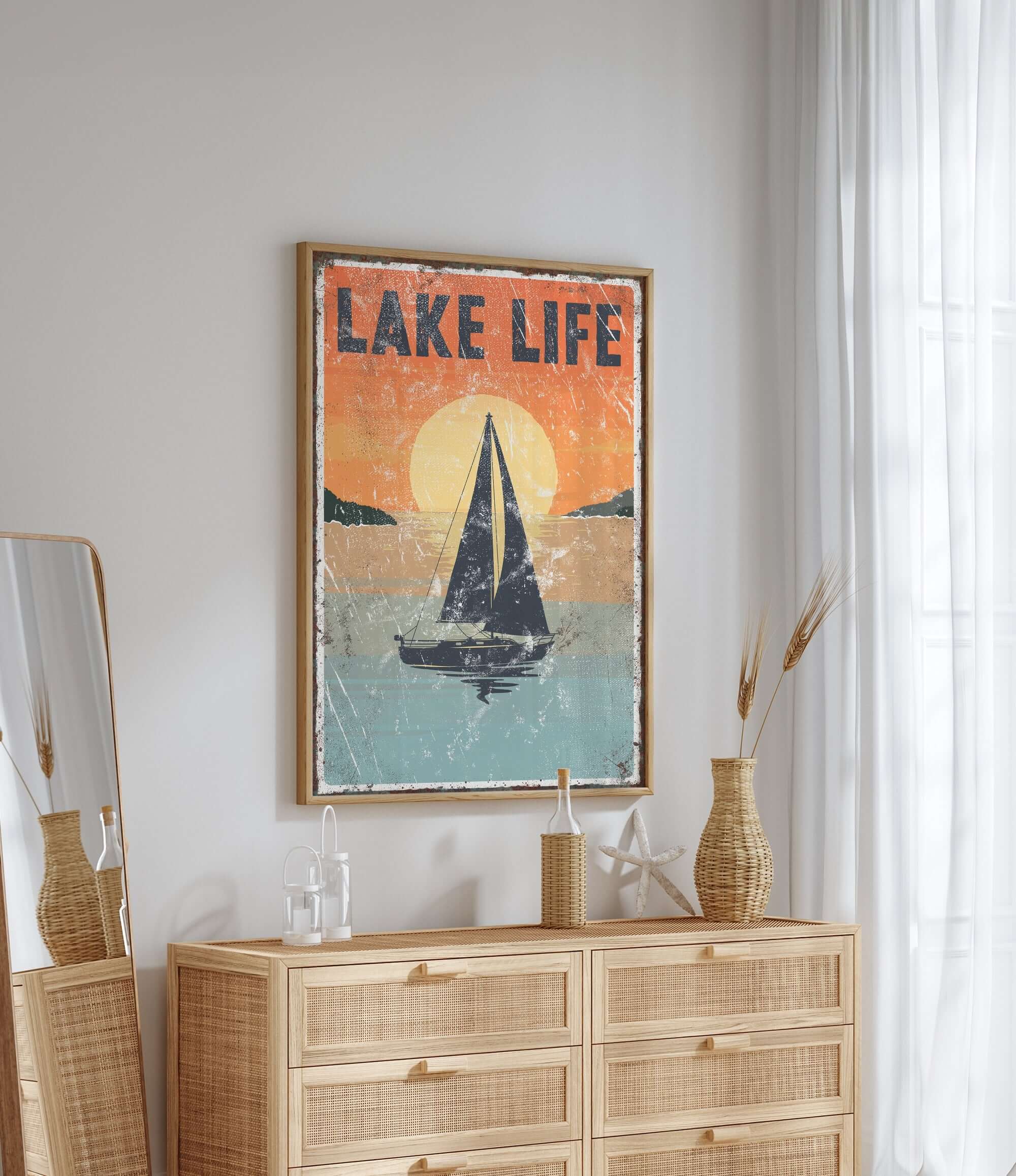 a picture of a sailboat on a wall above a dresser