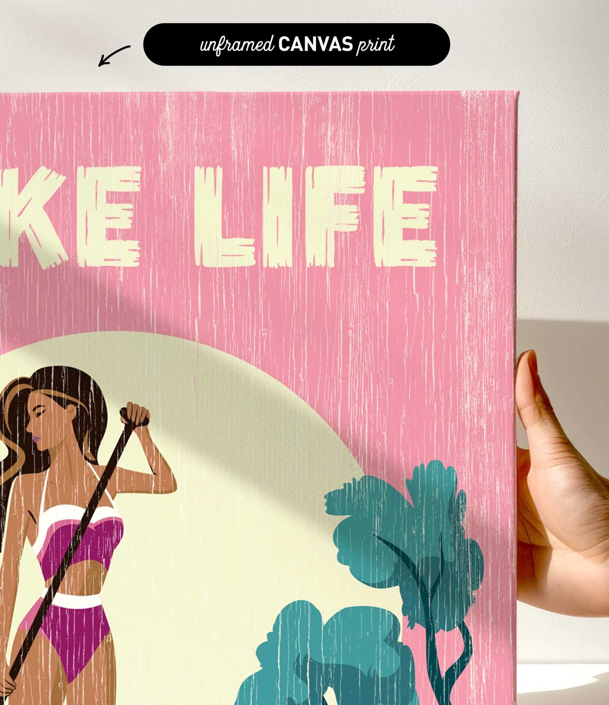 a hand holding a pink canvas print with a stylized illustration of a woman in a bikini.