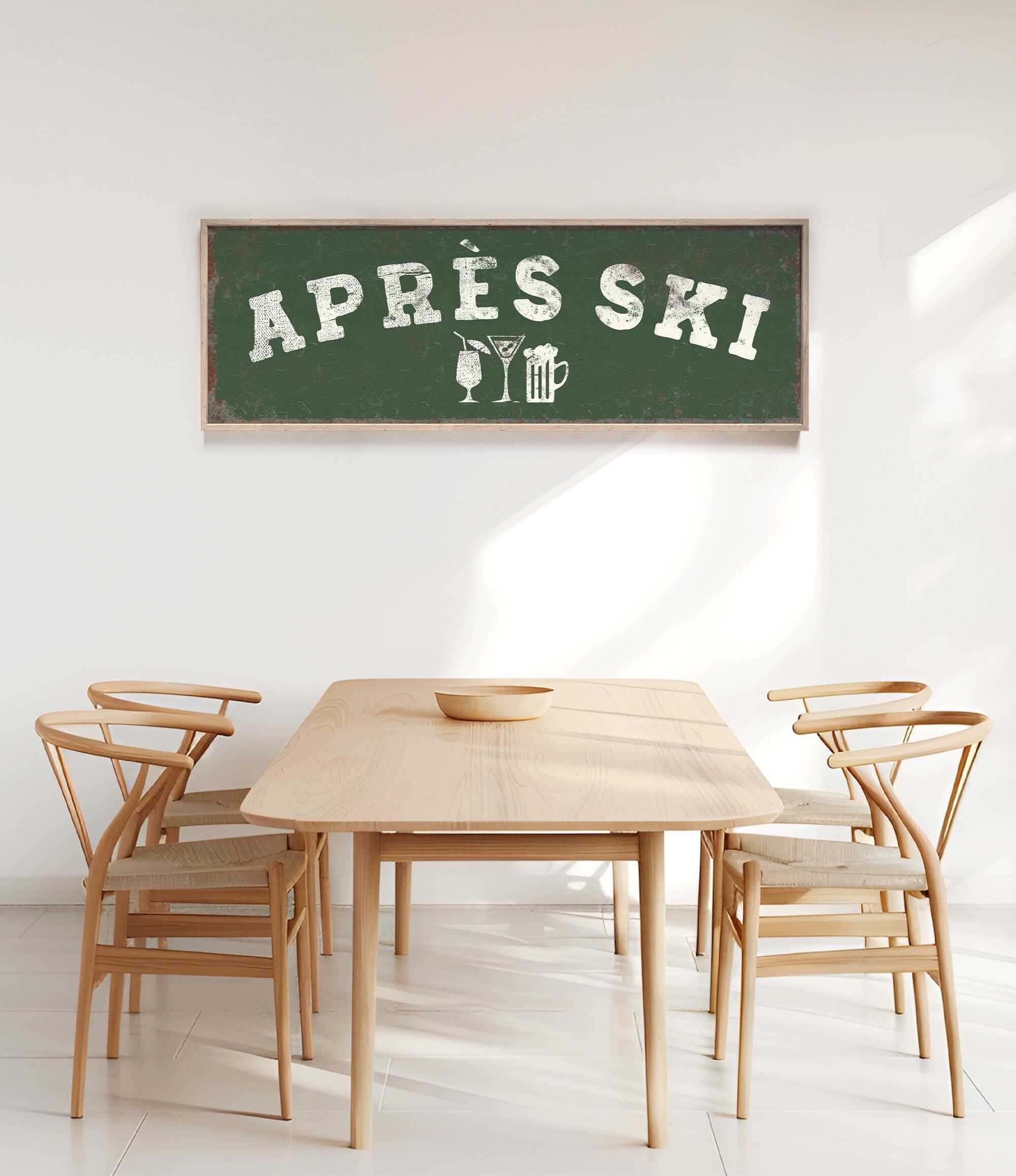 a wooden dining table with four chairs, and a large green sign with white text hanging above the table.