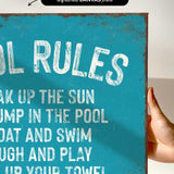 a hand holding a sign that says pool rules