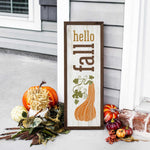 a wooden sign sitting on the side of a building