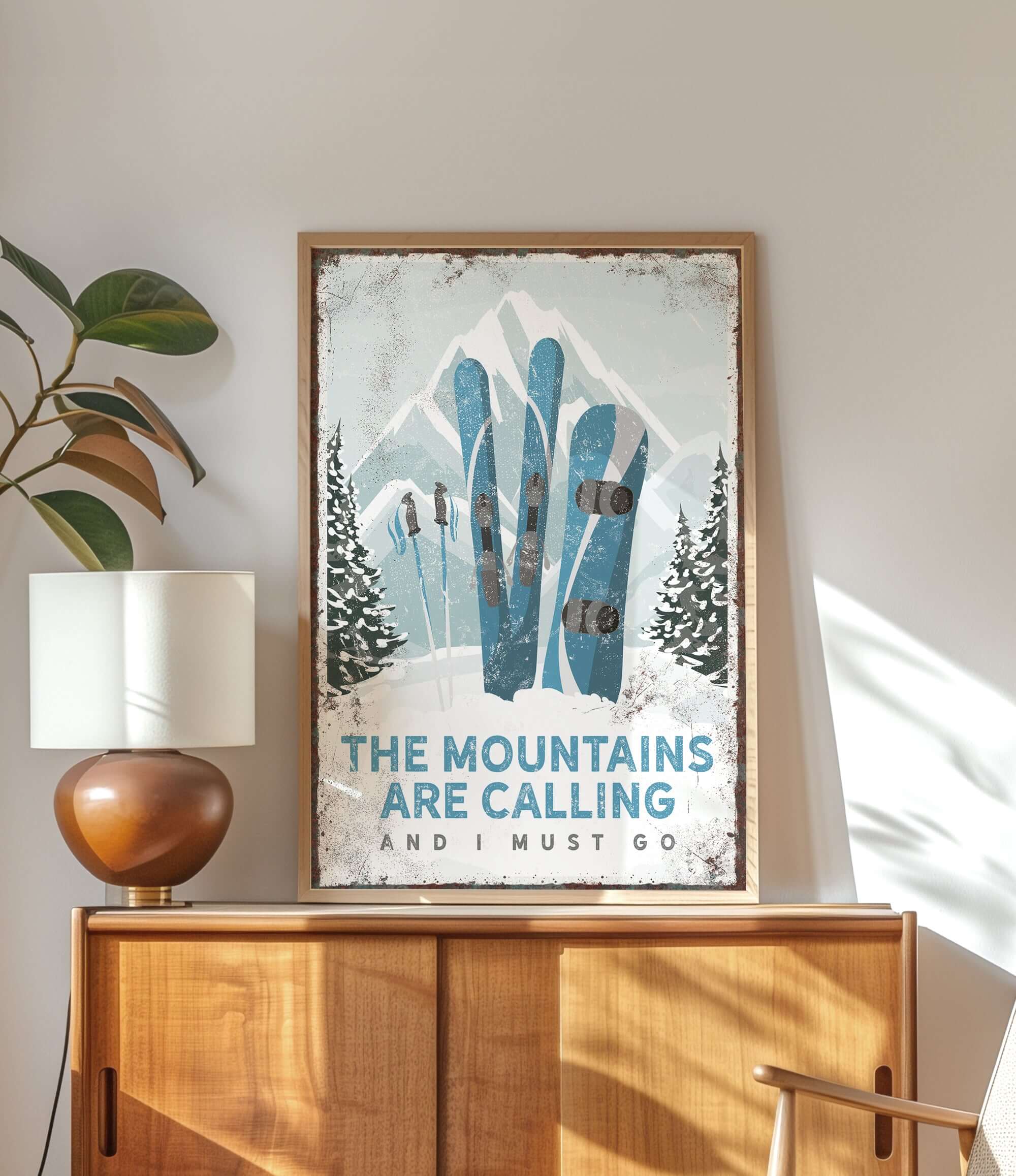 a poster of skis on a wall above a dresser