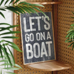 a sign that says let&#39;s go on a boat on a shelf