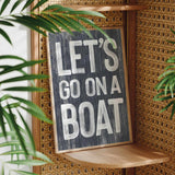 a sign that says let&#39;s go on a boat on a shelf