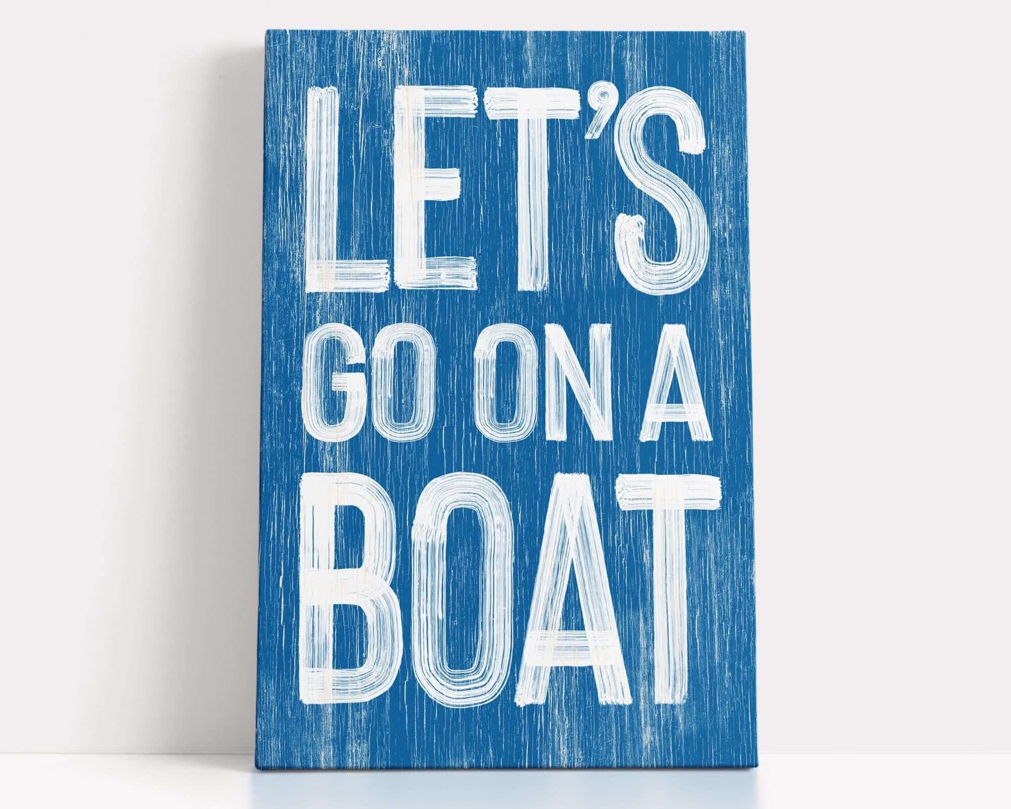 a wooden sign that says let's go on a boat