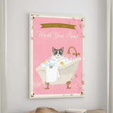 A framed poster with a cat sitting in a bathtub filled with bubbles, accompanied by the text "Please don't forget to wash your pans".
