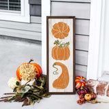 a picture of pumpkins and gourds on a porch
