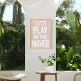 a living room with a plant and a sign on the wall