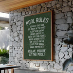 a sign on a stone wall in a restaurant