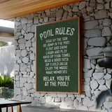 a sign on a stone wall in a restaurant