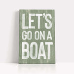 a wooden sign that says let&#39;s go on a boat