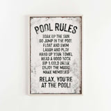 a sign on a wall that says pool rules