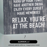 a textured background with a message encouraging relaxation and enjoyment at the beach.